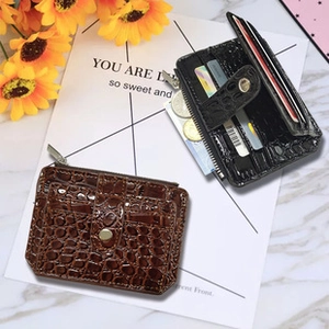 Detail of brown and black crocodile pattern PU leather wallets with multiple card slots