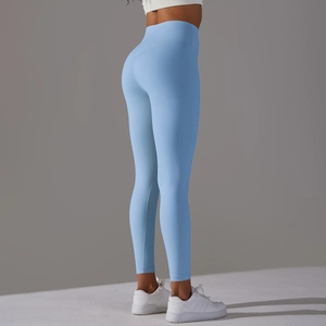 Close-up of high-waist light blue yoga leggings showing seamless butt-lifting effect