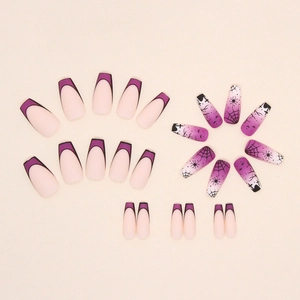 Macro detail of matte purple gradient nails with spider web and bat Halloween designs