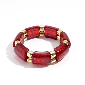 Bohemian elastic bracelet with red glitter resin beads and gold metal spacers