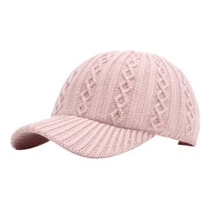 Pink knit baseball cap featuring classic cable stitch and warm autumn winter texture