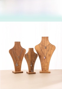 Three-piece wooden necklace display stand set in various heights for window showcase