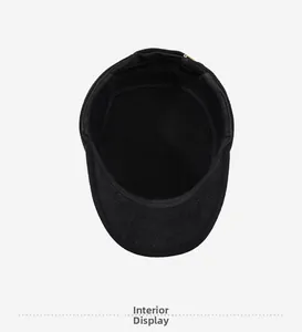 Detailed interior view of black wool winter hat showing fine lining and sweatband