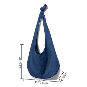 Detailed view of striped canvas hobo bag with knotted shoulder strap and size dimensions
