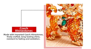 Macro detail of golden Kirin keychain with sparkling Czech rhinestones and enamel finish