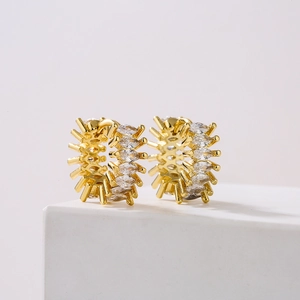 Gold plated hoop earrings with marquise-cut cubic zirconia in a sunburst gear design