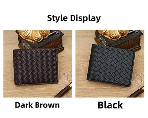 Detail of woven leather wallets in black and dark brown on a vintage wooden desk