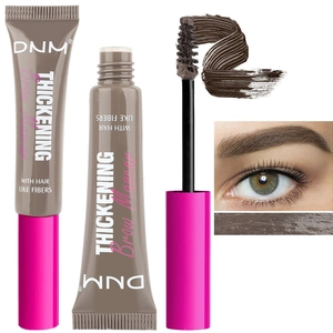 Detail showing the brown fiber brow mascara tube, applicator brush, and makeup effect