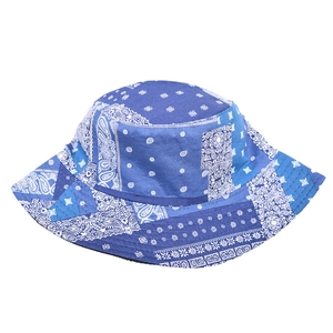Detail of blue paisley patchwork pattern on cotton bucket hat with visible stitching