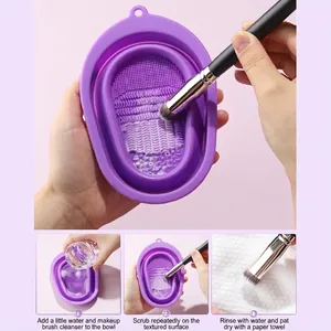 Foldable silicone makeup brush cleaning bowl with textured base and three-step usage guide