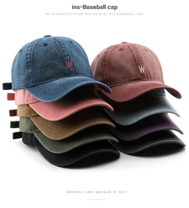 Stacked vintage washed cotton baseball caps with W letter embroidery in multiple colors
