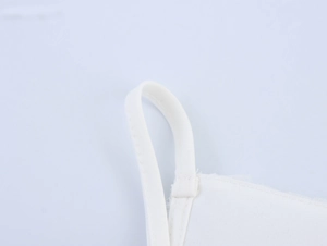 Close-up of white cotton camisole shoulder strap stitching and fabric texture