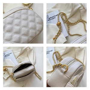 Close-up of quilted white PU leather, gold chain strap, and double zipper dual compartment