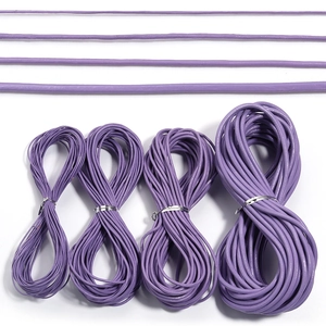 Detail showing four different diameters of purple leather cords for DIY jewelry projects