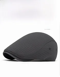 Detail view of dark gray beret flat cap with vertical stripes and metal air vent holes