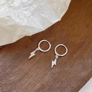 Silver hoop earrings with lightning bolt pendants encrusted with white zircon stones