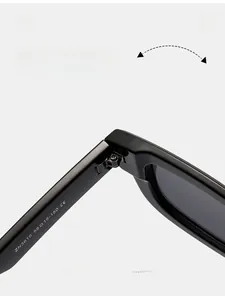 Macro view of durable metal hinge and CE mark engraving on black square sunglasses