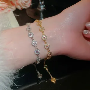 Elegant 18K gold plated round cubic zirconia tennis bracelet set displayed on a female wrist