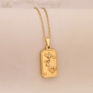 Detail of gold rectangular star and sun pendant necklace with sparkling clear zirconias