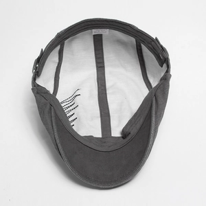 Inside view of men's cotton beret showing quality lining and adjustable strap detail