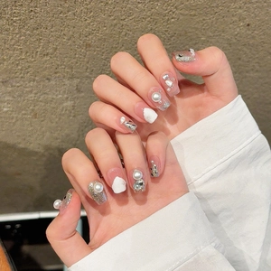 Elegant handmade French press-on nails with pearls, silver glitter, and rhinestones