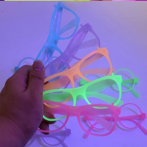 Macro detail of neon glowing glasses frames in multiple colors for festive party events