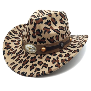 Detail of western cowboy hat featuring leopard print and leather band with bull buckle