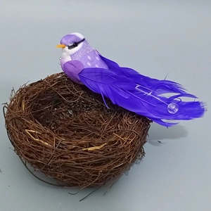 Detailed view of purple feather bird resting in a brown rattan nest for Easter decoration