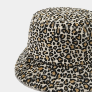 Close-up of leopard print plush bucket hat with soft faux fur texture and warm fabric