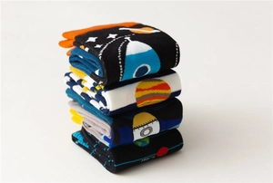 Detail of space-themed cotton socks featuring Mars lettering and rocket embroidery