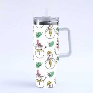 Detail of 40oz white insulated tumbler featuring repetitive cartoon snowman patterns