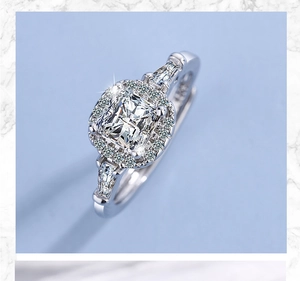 Detailed macro view of silver ring featuring square center diamond and halo setting