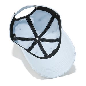 Detail of light blue distressed baseball cap featuring inner seams and adjustable strap