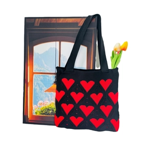 Minimalist black knitted tote bag with red heart pattern and large capacity design
