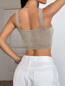 Macro view of the khaki ribbed knit texture and back square neck design of the crop top