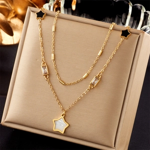 Double-layer gold necklace with black and white star pendants and clear zircon stones