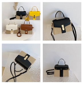 Detailansicht der gewebten Stroh- und Kunstleder-Patchwork-Tasche mit Metallverschluss