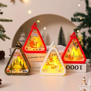 Festive Christmas lanterns with Santa and deer patterns on a cozy tabletop setting