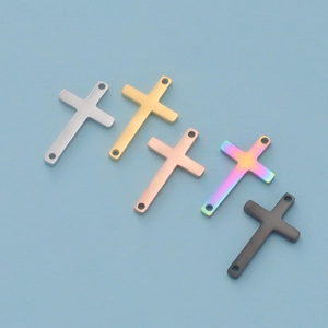 Polished stainless steel double-hole cross pendants in five colors on a blue background