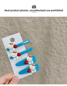 Details zu vier blauen Hello Kitty Haarklammern mit roten Herzen auf einer Karte