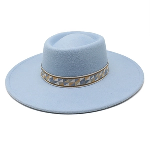 Detail of light blue wide brim wool fedora hat featuring a bohemian woven geometric band
