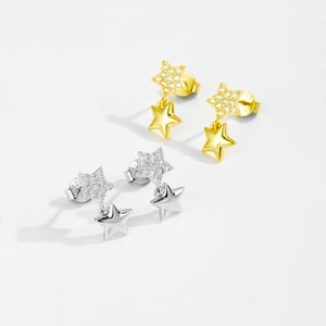 Macro shot of S925 silver star earrings with pave zircon and hanging metal stars
