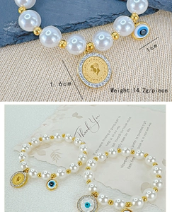 Detail of beaded pearl bracelet featuring 1.6cm coin and 1cm evil eye charm, weighing 14.2g