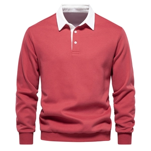 Detail of white polo collar and ribbed cuffs on brick red long sleeve sweatshirt