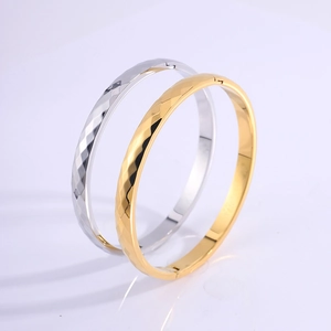 Modern 18k gold plated stainless steel bangles with geometric faceted diamond pattern