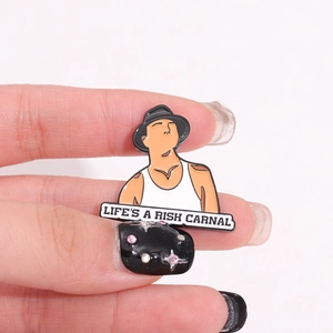 Enamel pin featuring cartoon character and Life's a Rish Carnal text in black hat