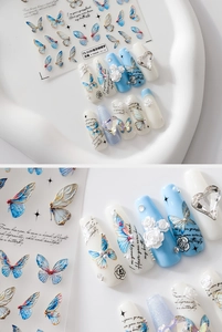 Detailed 5D embossed butterfly nail art stickers with metallic blue stars and poetry text