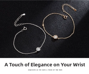 Macro shot of silver and rose gold bubble bracelets with bezel-set stones on black leather