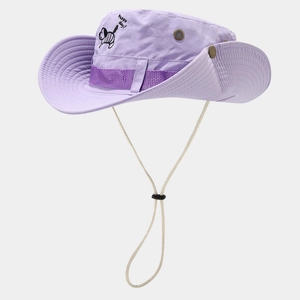 Detail of purple outdoor sun hat with cartoon dog print and metal ventilation eyelets