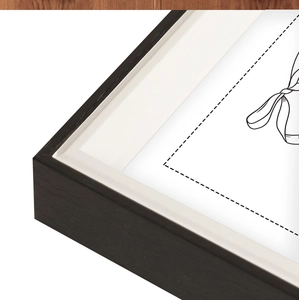 Black wooden photo frame with clear wood grain texture and white beveled mat